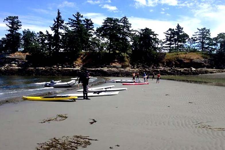 Stand Up For Men’s Health paddle boarders rest and lunch at Dionisio Point