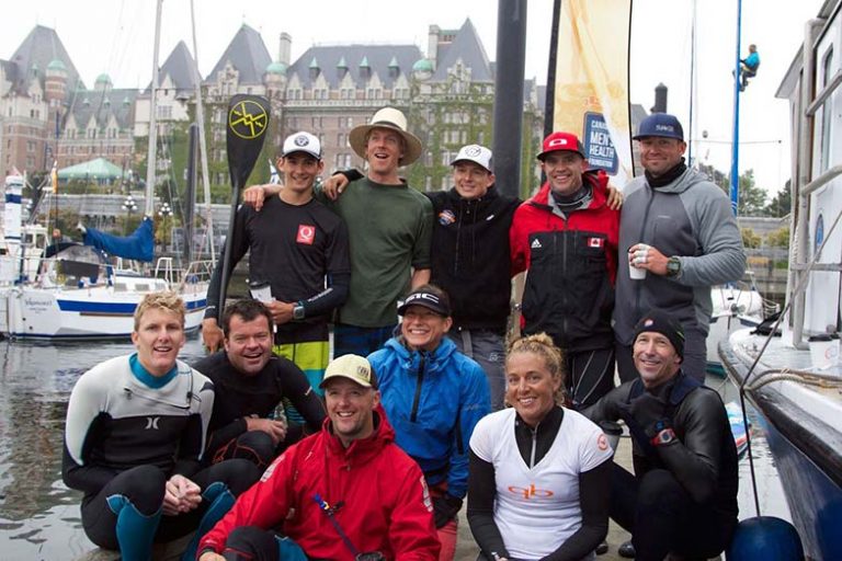 Stand Up For Men's Health paddlers group photo at the finish line at Victoria Harbour