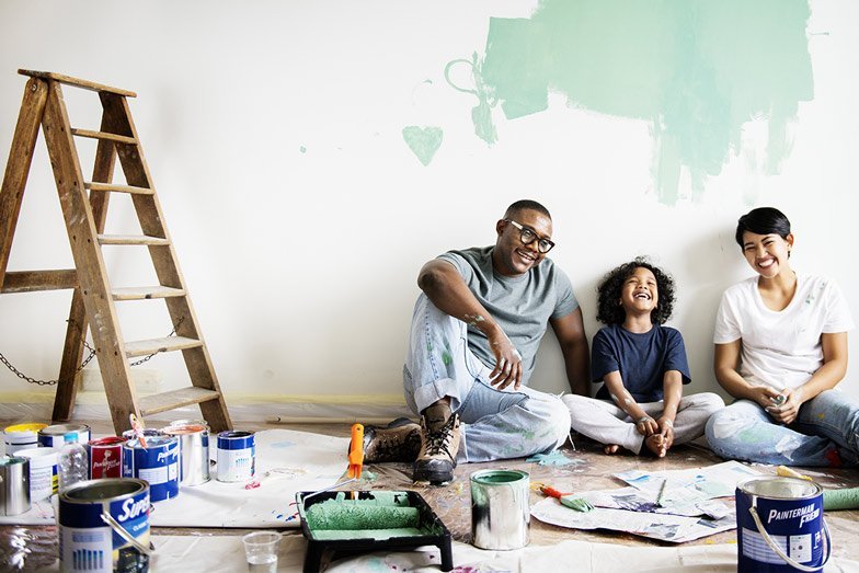A nice family painting a room together