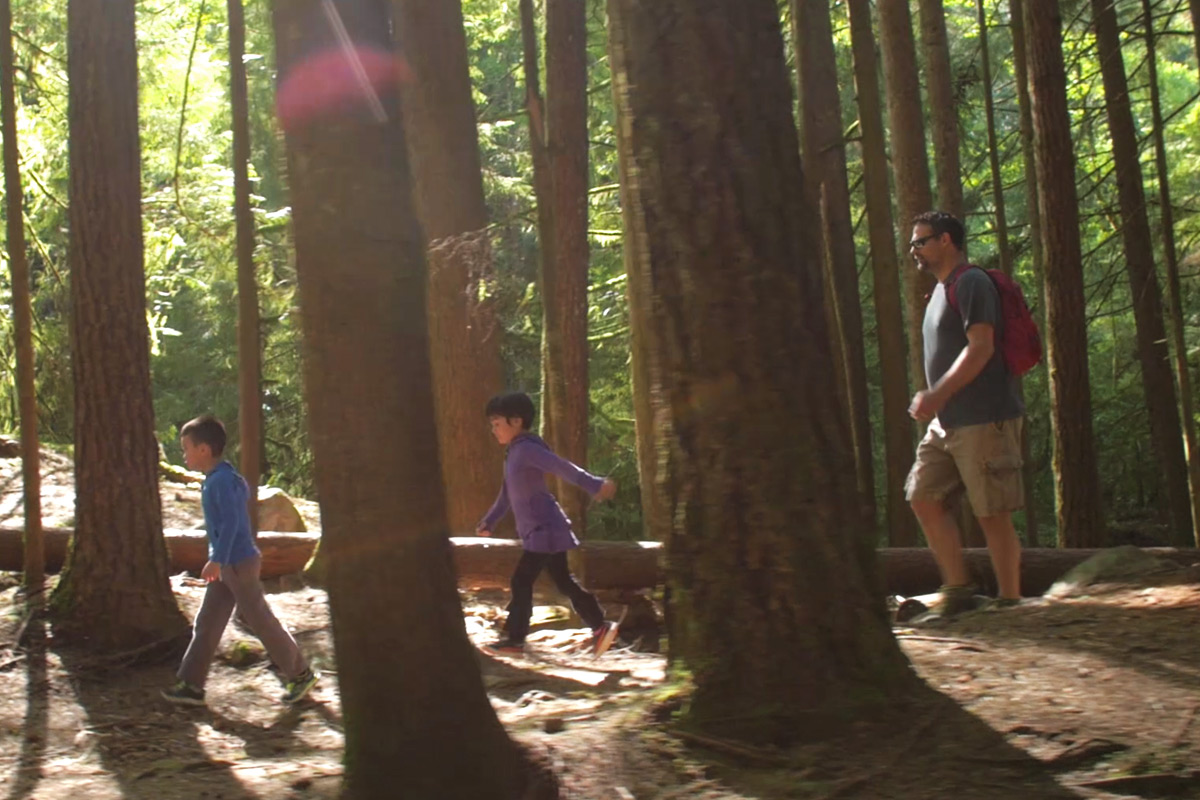 Alan Scholes and kids playing soccer at the park