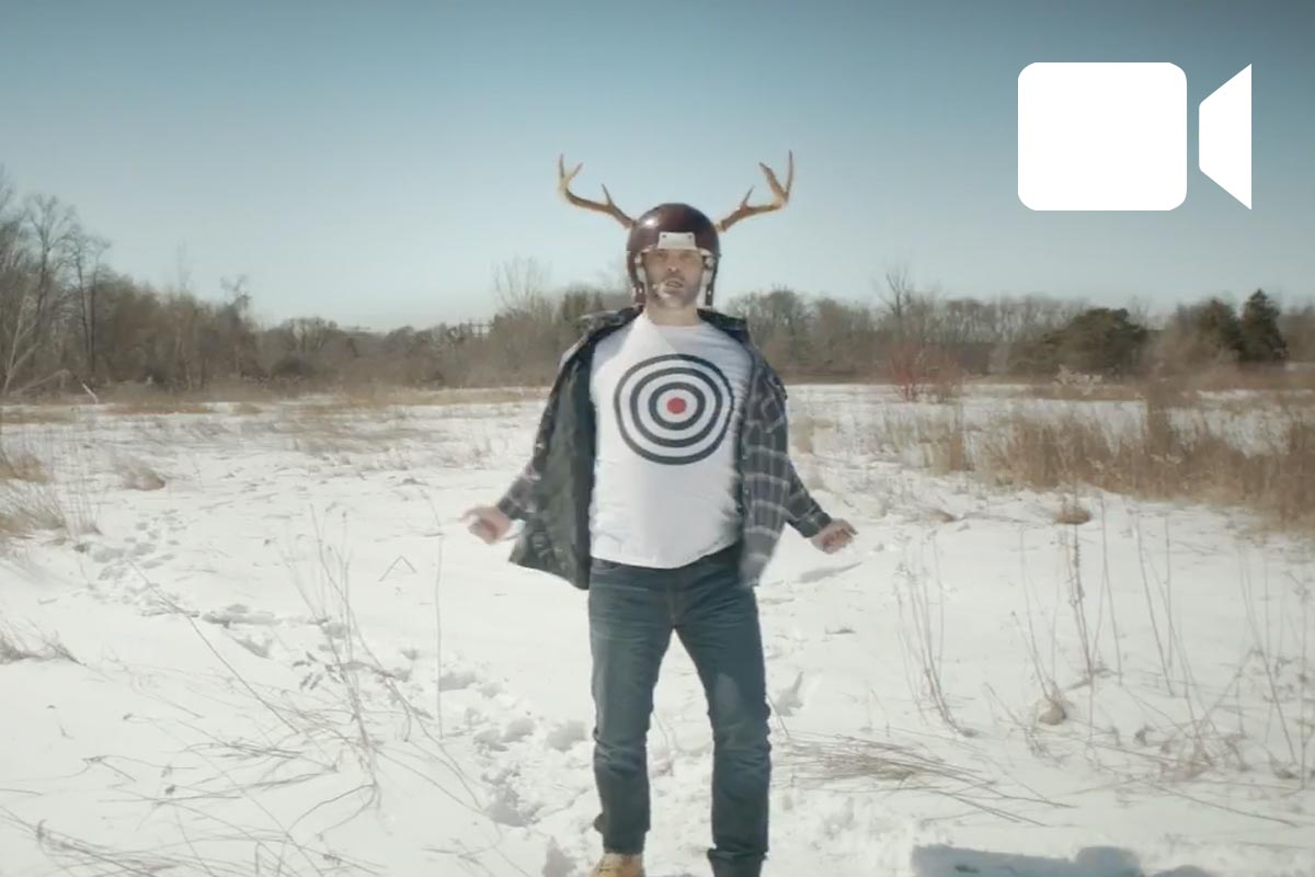 man walking in the forest with antler