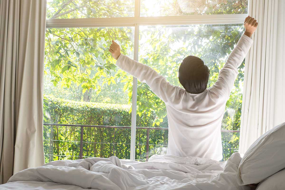 Men waking up refreshed in the morning