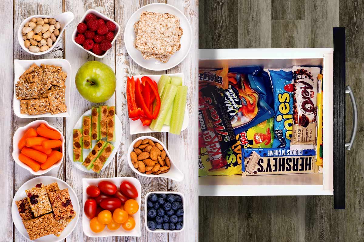 Unhealthy snacks hidden in a drawer beneath delicious healthy ones