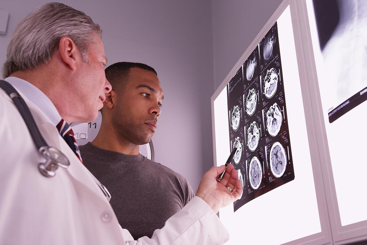 Doctor explaining a patient's brain scan