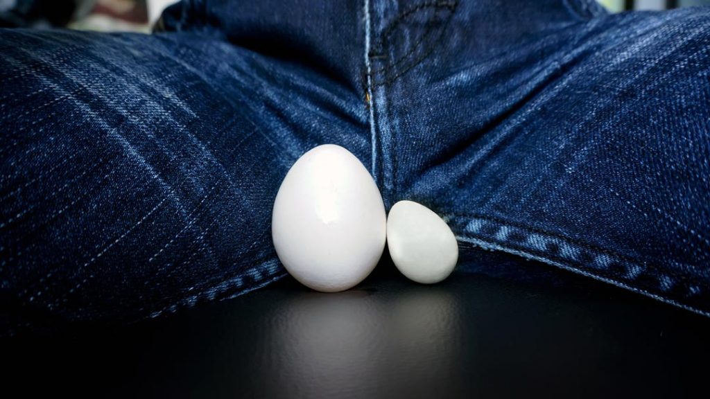 two eggs between man's legs