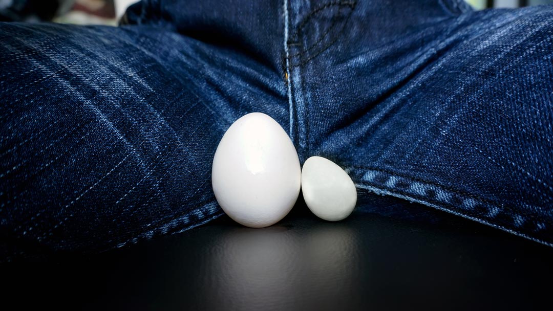 two eggs between man's legs