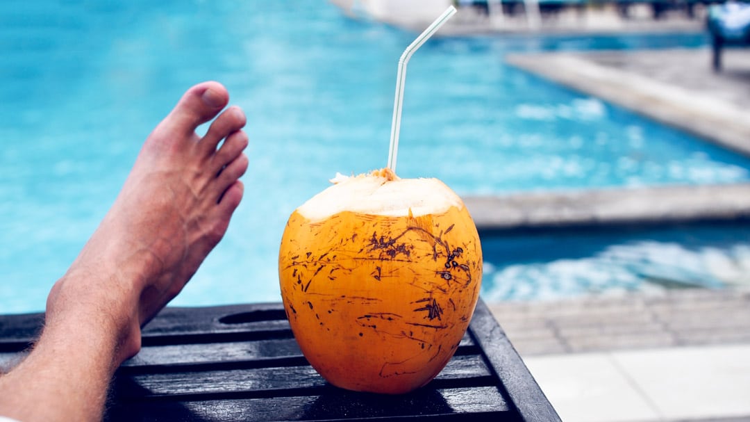 Man drinking coconut water for hydration