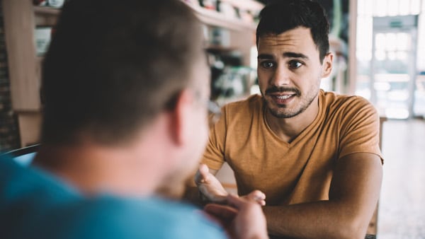 Man talking to friend