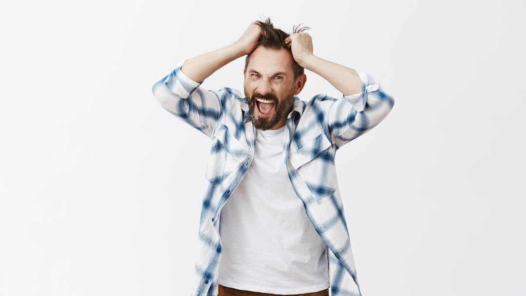 Stressed out man pulling hair