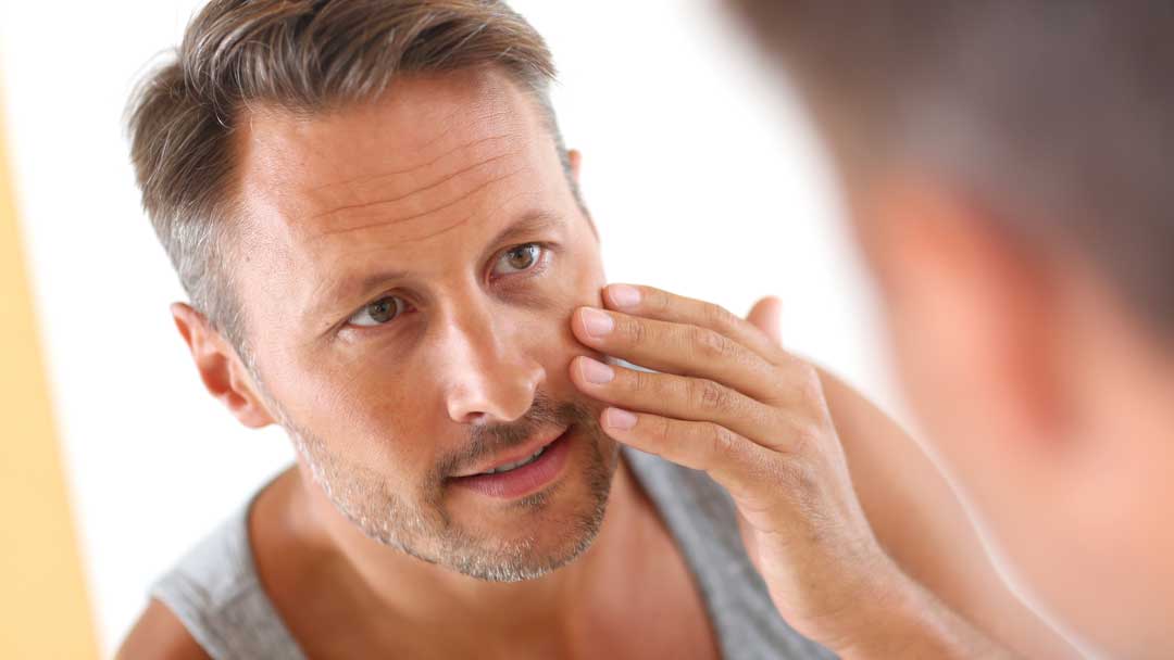 Man checking his face