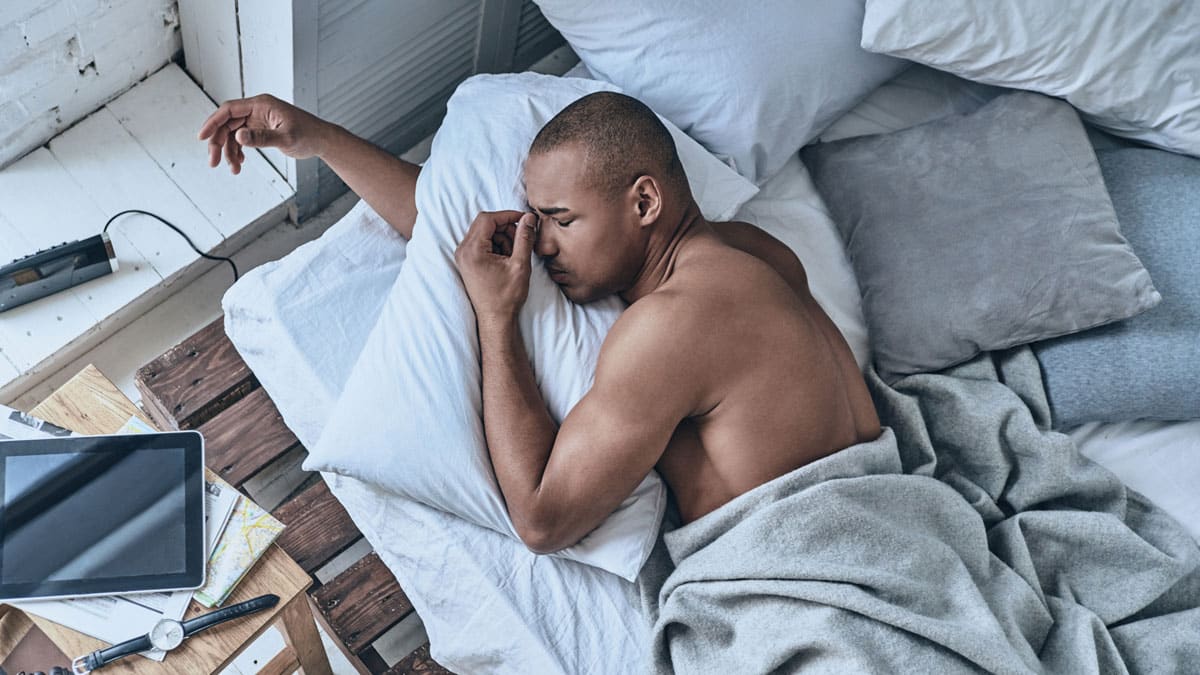 Man struggling to sleep