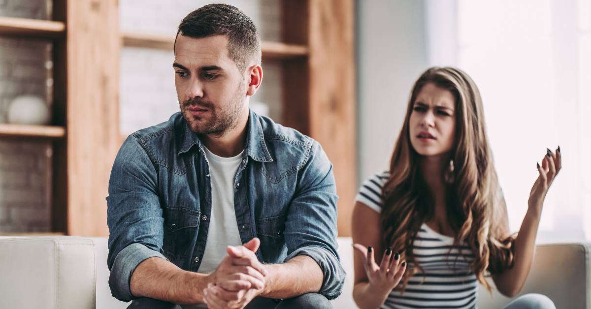 couple arguing on couch