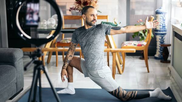man working out with online class