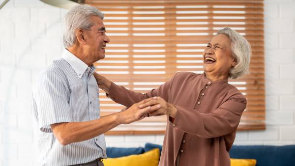 older couple dancing and laughing