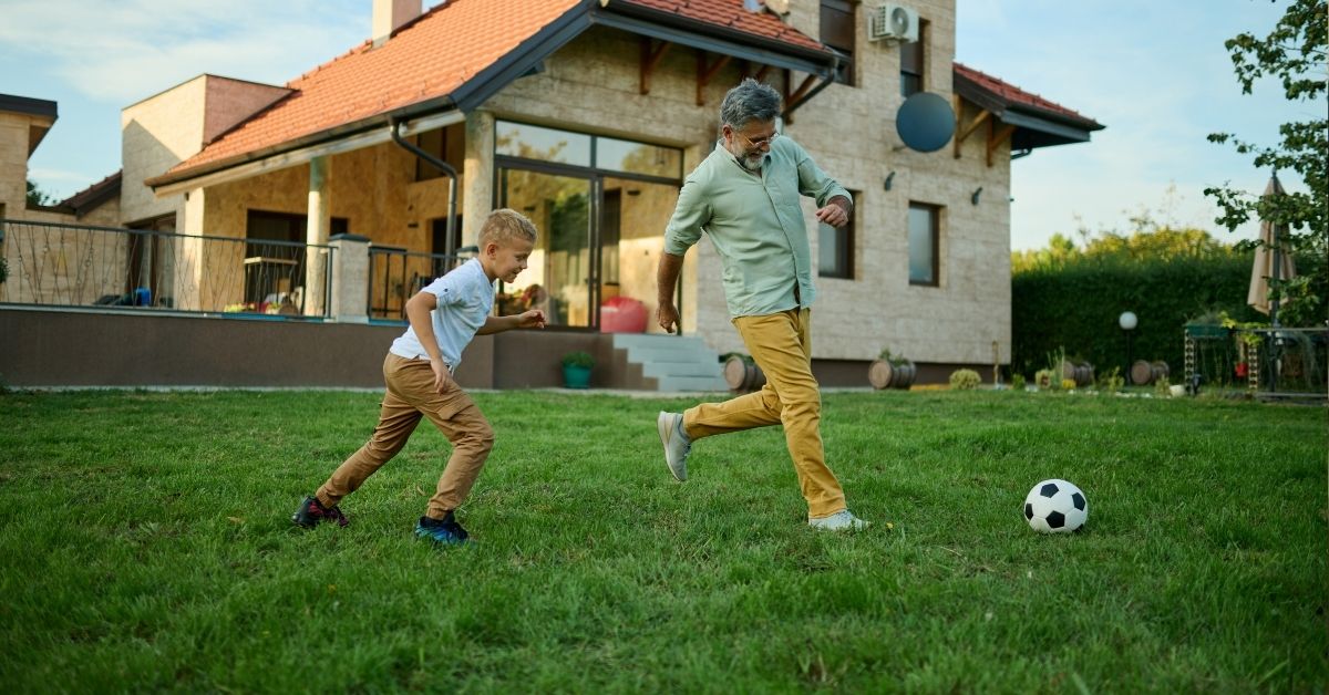 grandpa-grandson-playing-soccer