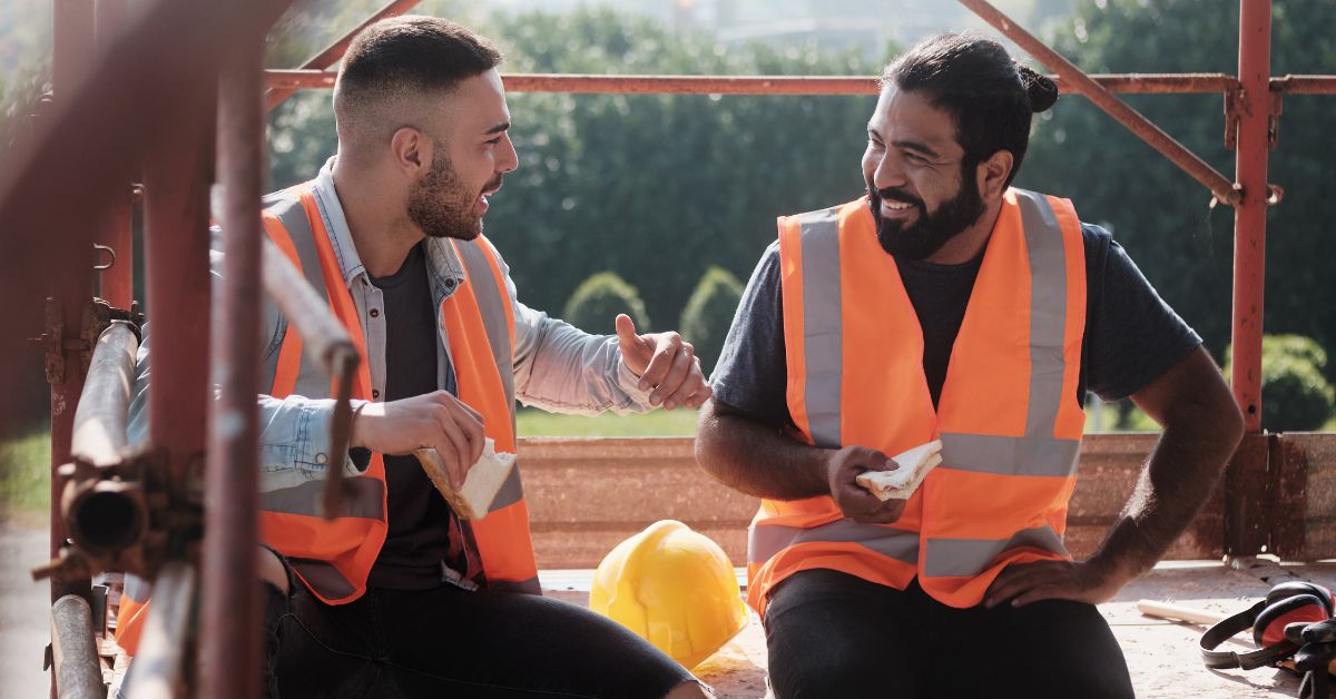 two guys eating lunch on job site
