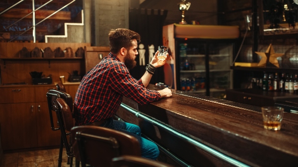 man sitting alone bar