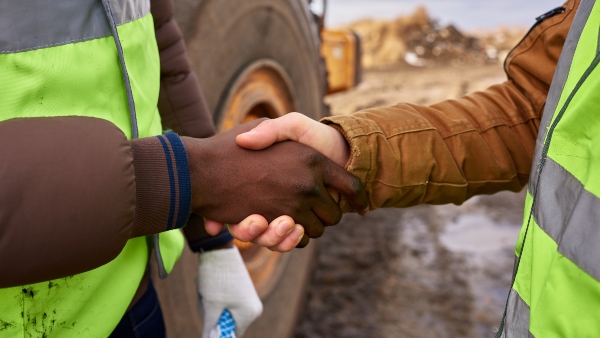 men shaking hands construction