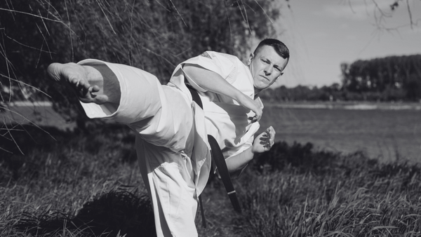 man doing karate outside