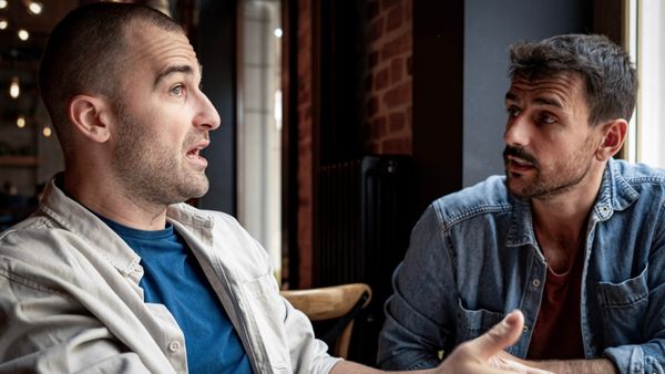 inline men chatting in cafe
